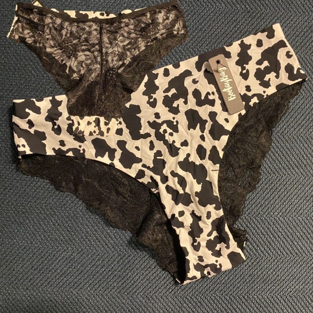 Cow print in the front, black lace in the back Cow print in the front, black lace in the back